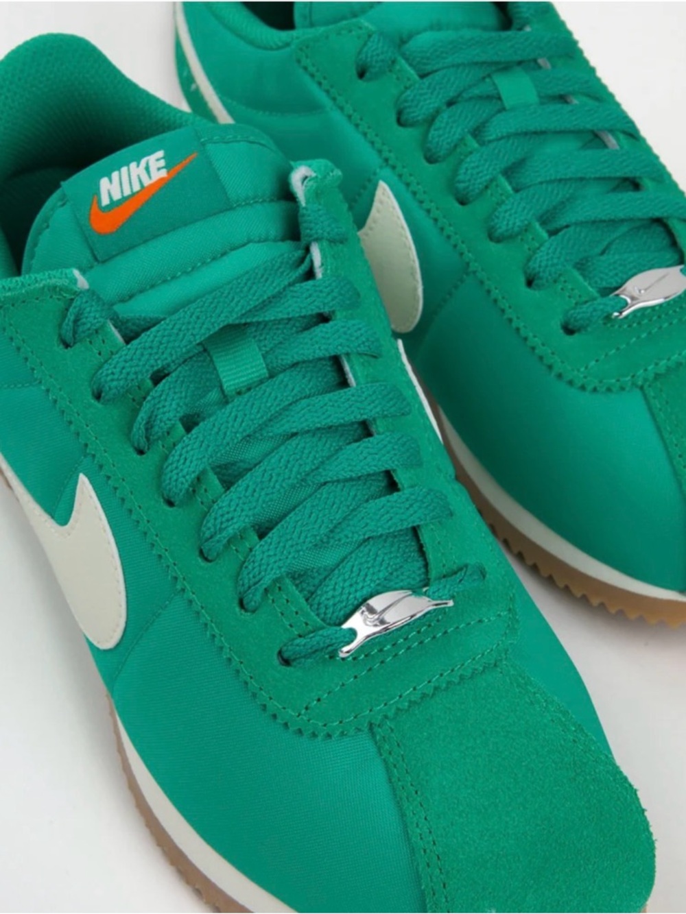 Nike Green Low-Top Sneakers with White Swoosh and Orange Tongue Logo worn once